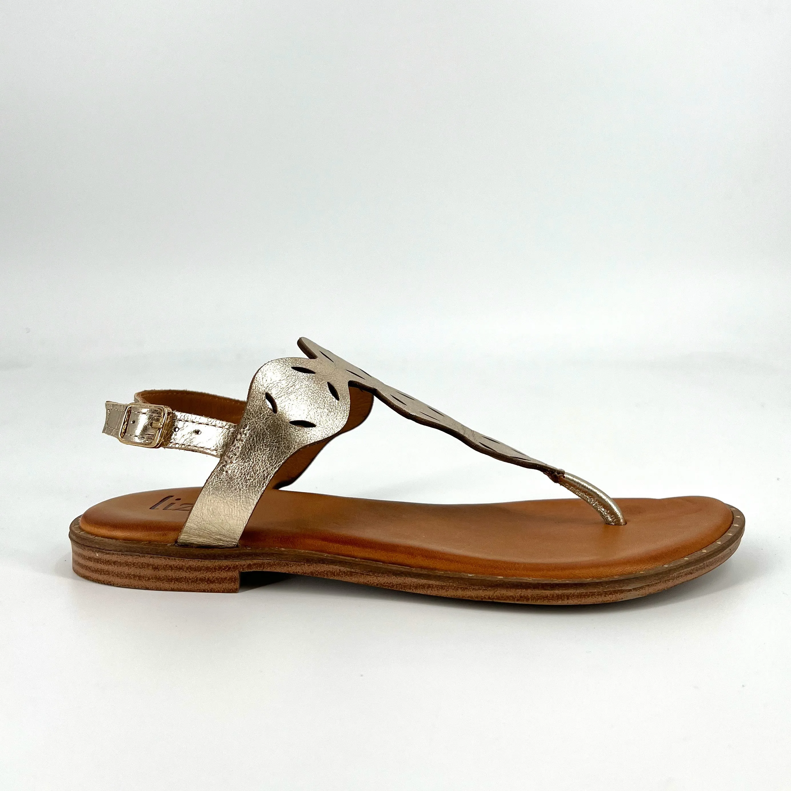 The Laser Cut Comfort Thong Sandal in Gold